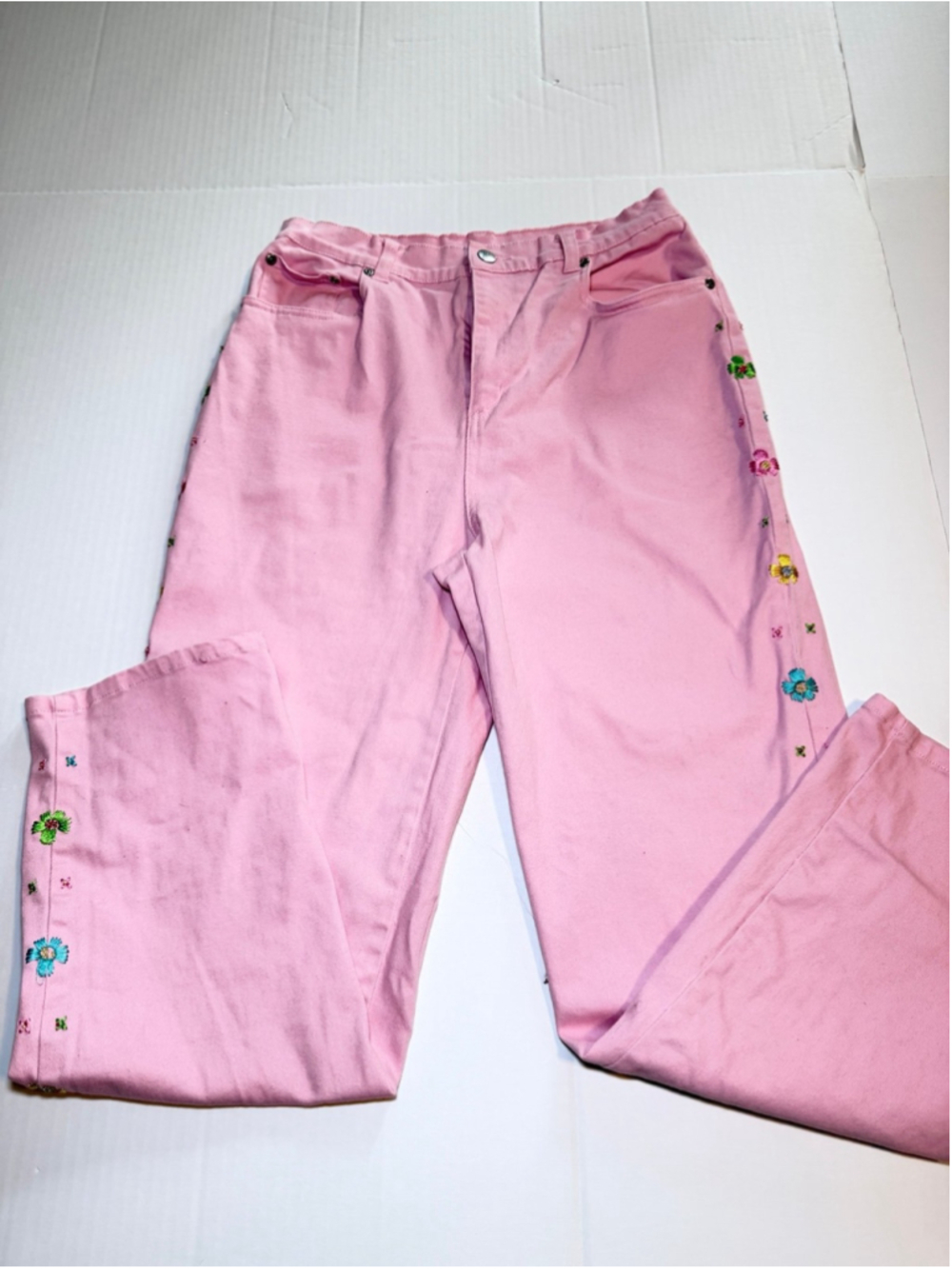 Quacker Factory pink denim pants with embroidered floral details on side seam